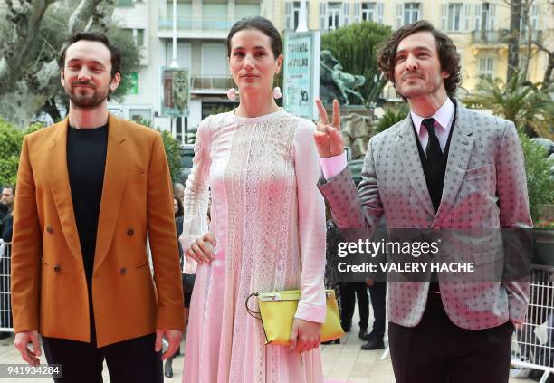 British actors Alexander Vlahos, Elisa Lasowski and George Blagden of the "Versailles" television series pose as they arrive for the opening of the...