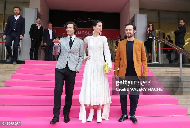 British actors Alexander Vlahos, Elisa Lasowski and George Blagden of the "Versailles" television series pose as they arrive for the opening of the...