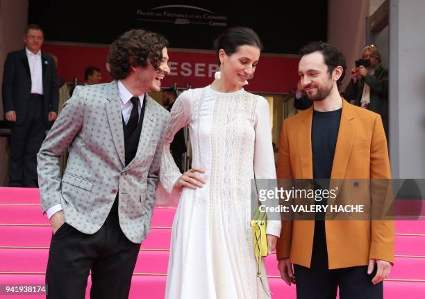 British actors Alexander Vlahos, Elisa Lasowski and George Blagden of the "Versailles" television series pose as they arrive for the opening of the...