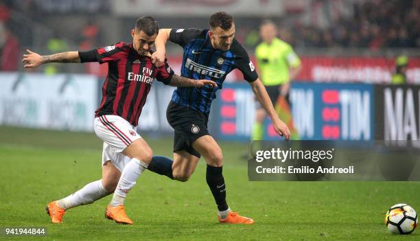 Ivan Perisic of FC Internazionale Milano competes for the ball with Fernandez Suso of AC Milan during the serie A match between AC Milan and FC...