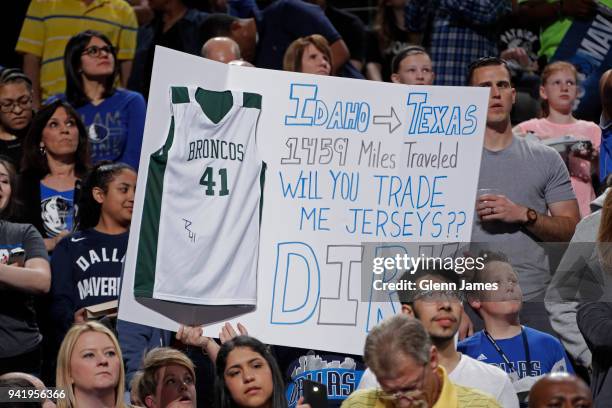Fans hold signs during the game between the Minnesota Timberwolves and Dallas Mavericks on March 30, 2018 at the American Airlines Center in Dallas,...