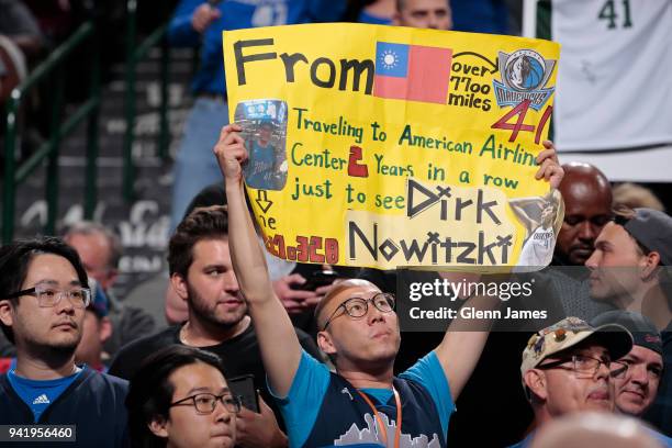 Fans hold signs during the game between the Minnesota Timberwolves and Dallas Mavericks on March 30, 2018 at the American Airlines Center in Dallas,...