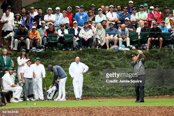 Sandy Lyle of Scotland plays his shot from the ninth tee during the Par 3 Contest prior to the start of the 2018 Masters Tournament at Augusta...
