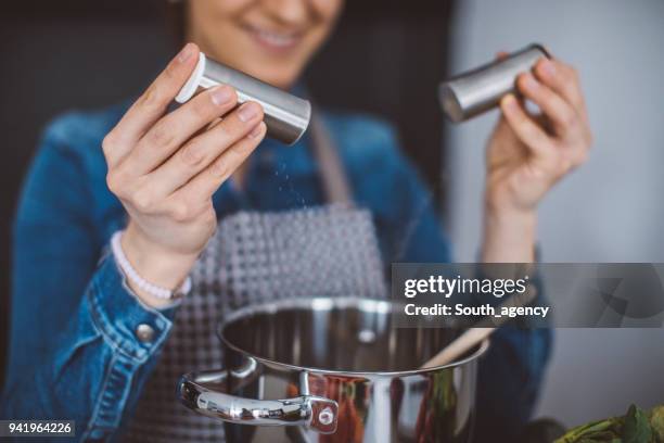 woman making lunch - salt shaker stock pictures, royalty-free photos & images