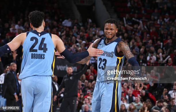 Dillon Brooks and Ben McLemore of the Memphis Grizzlies exchange a high five during the game against the Portland Trail Blazers on April 1, 2018 at...
