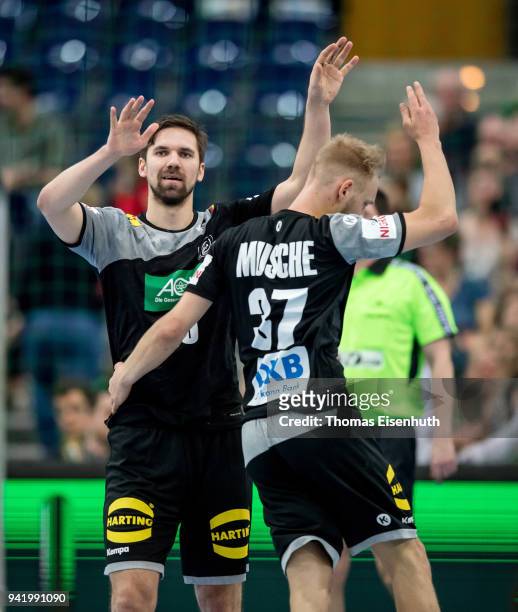 Fabian Wiede of Germany celebrates with Matthias Musche during the handball international friendly match between Germany and Serbia at Arena Leipzig...