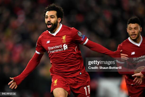 Mohamed Salah of Liverpool celebrates after scoring his sides first goal during the UEFA Champions League Quarter Final Leg One match between...