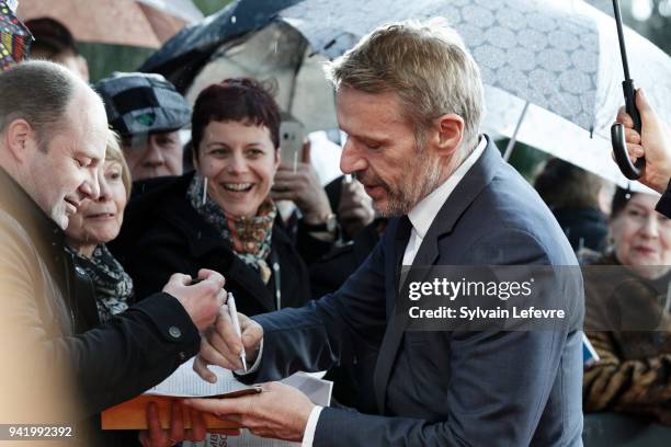 Jury president Lambert Wilson signs autographs as he arrives for opening ceremony of 10th Beaune International Thriller Film Festival on April 4,...