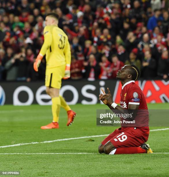 Sadio Mane of Liverpool celebrates the third goal during the UEFA Champions League Quarter Final Leg One match between Liverpool and Manchester City...