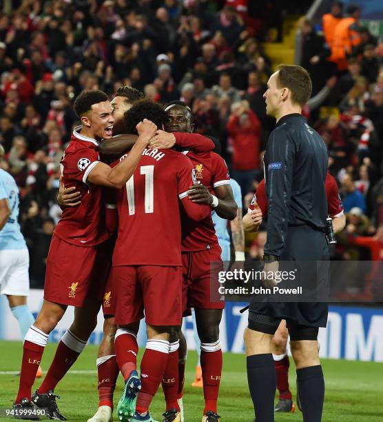 Sadio Mane of Liverpool celebrates the third goal during the UEFA Champions League Quarter Final Leg One match between Liverpool and Manchester City...