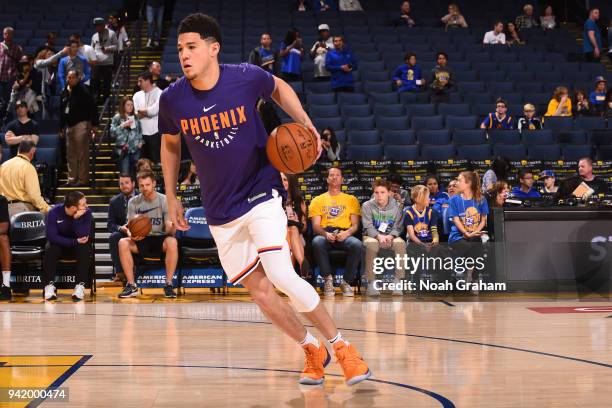 Devin Booker of the Phoenix Suns warms up prior to the game against the Golden State Warriors on April 1, 2018 at ORACLE Arena in Oakland,...