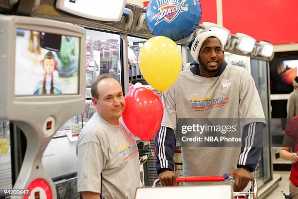 White along with players and coaches from the Oklahoma City Thunder host a shopping spree for low-income families at the City Super Target in...