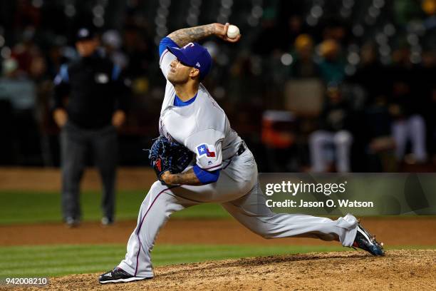 Matt Bush of the Texas Rangers pitches against the Oakland Athletics during the eighth inning at the Oakland Coliseum on April 2, 2018 in Oakland,...