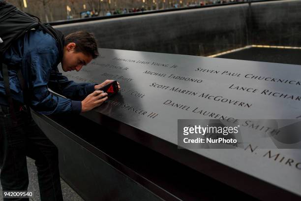 People visit The National September 11 Memorial in New York, March 13, 2018. The National September 11 Memorial &amp; Museum is a memorial and museum...