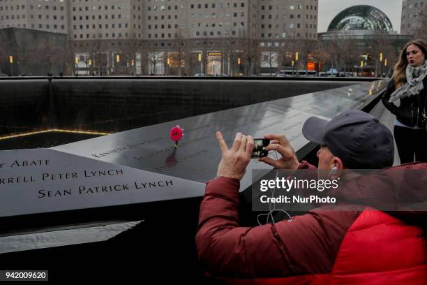 People visit The National September 11 Memorial in New York, March 13, 2018. The National September 11 Memorial &amp; Museum is a memorial and museum...