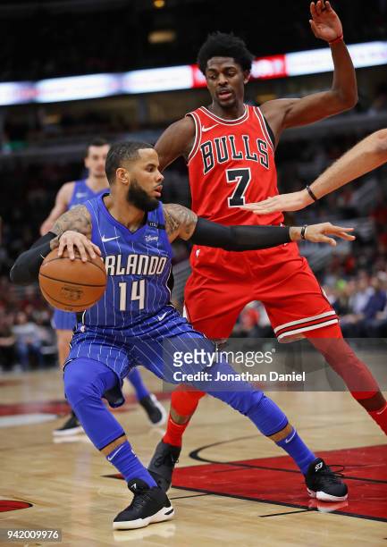 Augustin of the Orlando Magic moves against Justin Holiday of the Chicago Bulls at the United Center on February 12, 2018 in Chicago, Illinois. The...