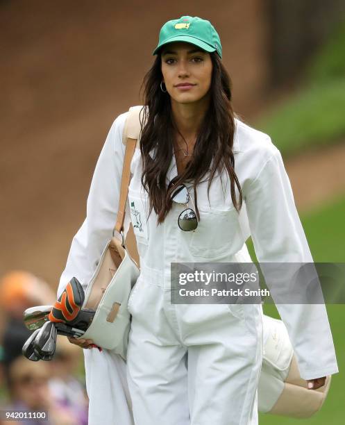 Allison Stokke, girlfriend of Rickie Fowler of the United States , walks the course during the Par 3 Contest prior to the start of the 2018 Masters...