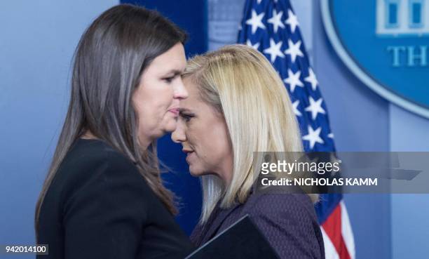 Homeland Security Secretary Kirstjen Nielsen and Press Secretary Sarah Huckabee Sanders cross paths at the podium during the press briefing at the...