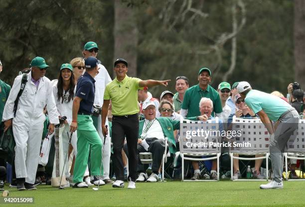 Rickie Fowler of the United States reacts alongside Jordan Spieth of the United States and Justin Thomas of the United States during the Par 3...