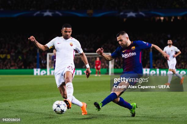 Jordi Alba of FC Barcelona plays the ball under pressure from Bruno Peres of AS Roma during the UEFA Champions League Quarter Final Leg One match...