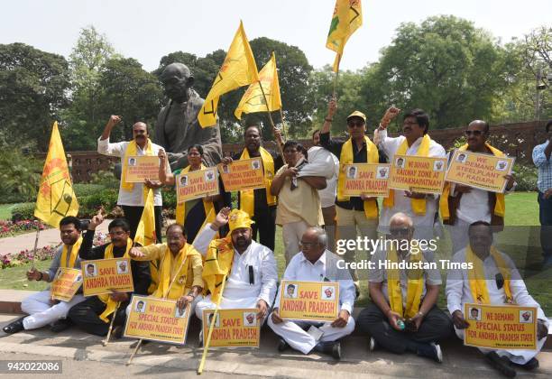 Naramalli Sivaprasad, dressed as a washerman, with others protest for demanding special status for the state of Andhra Pradesh during the Parliament...