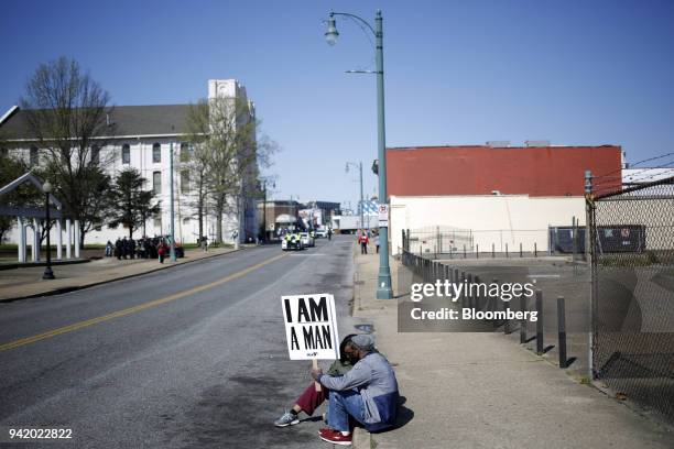 Demonstrators hold signs that read "I Am A Man" during a reenactment of the 1968 sanitation workers strike to commemorate the 50th anniversary of the...