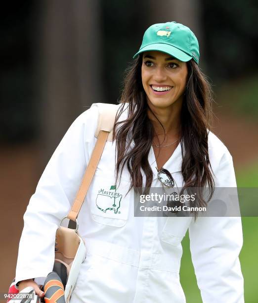 Allison Stokke, girlfriend of Rickie Fowler of the United States, smiles during the Par 3 Contest prior to the start of the 2018 Masters Tournament...