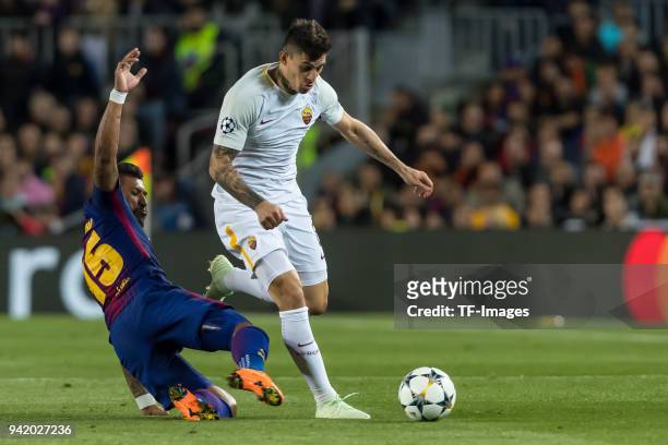 Paulinho of Barcelona and Diego Perotti of Rom battle for the ball during the UEFA Champions League Quarter-Final first leg match between FC...