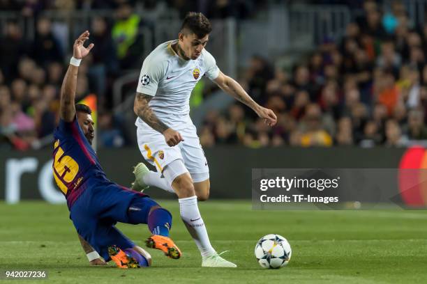 Paulinho of Barcelona and Diego Perotti of Rom battle for the ball during the UEFA Champions League Quarter-Final first leg match between FC...