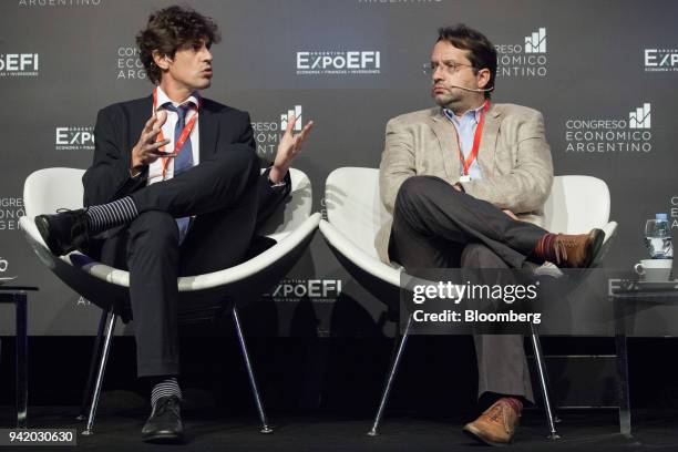 Martin Lousteau, Argentina's former economy minister, left, speaks while Marco Lavagna, deputy of the Renewal Front , listens during a panel...