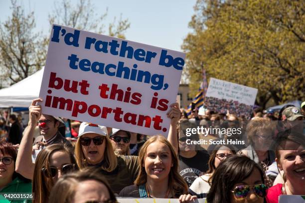 Thousands gathered and marched in a pitcket line outside the Oklahoma state Capitol building during the third day of a statewide education walkout on...