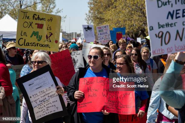 Thousands gathered and marched in a pitcket line outside the Oklahoma state Capitol building during the third day of a statewide education walkout on...