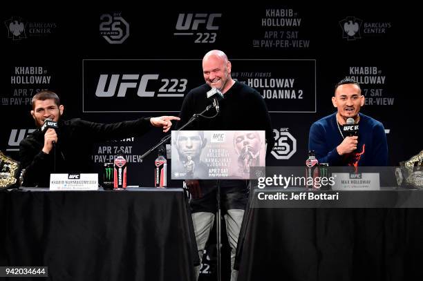 Khabib Nurmagomedov of Russia, UFC President Dana White and Max Holloway interact with media and fans during the UFC 223 Press Conference at the...