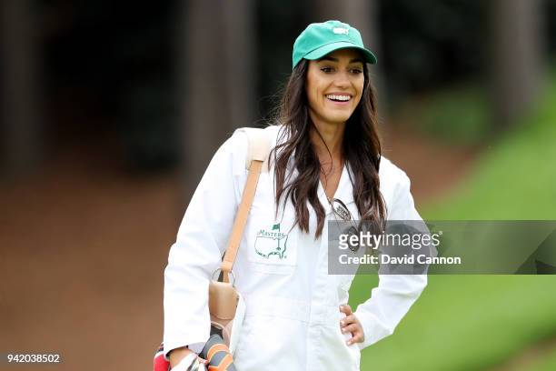 Allison Stokke, girlfriend of Rickie Fowler of the United States looks on during the Par 3 Contest prior to the start of the 2018 Masters Tournament...
