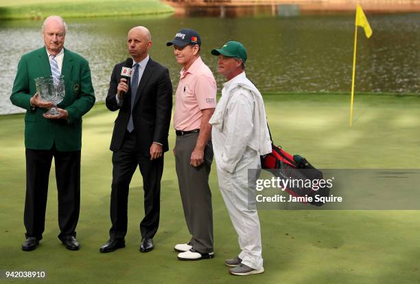 Tom Watson of the United States is awarded the trophy after winning the Par 3 Contest prior to the start of the 2018 Masters Tournament at Augusta...