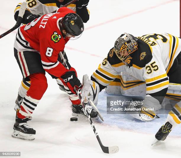 Anton Khudobin of the Boston Bruins stops a shot by Nick Schmaltz of the Chicago Blackhawks at the United Center on March 11, 2018 in Chicago,...