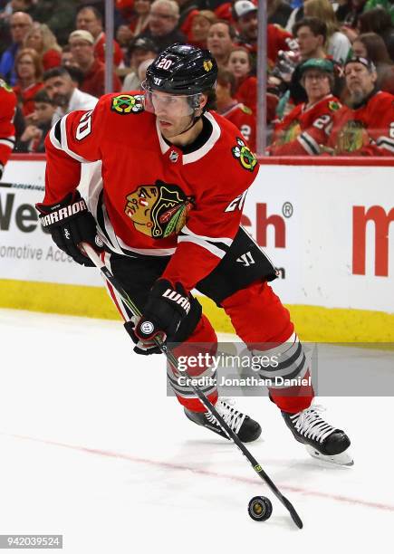 Brandon Saad of the Chicago Blackhawks looks to pass against the Boston Bruins at the United Center on March 11, 2018 in Chicago, Illinois. The...