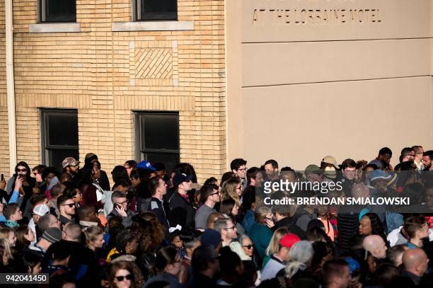 People listen to speakers at the Lorraine Motel during commemorations marking the 50th anniversary of the assassination of Martin Luther King Jr.,...