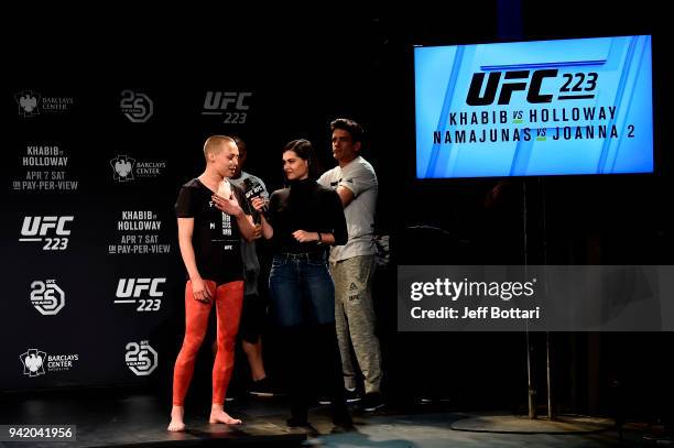 Rose Namajunas interacts with UFC host Megan Olivi during the UFC 223 Open Workouts at the Music Hall of Williamsburg on April 4, 2018 in Brooklyn,...