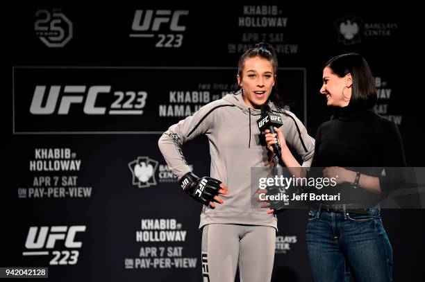 Joanna Jedrzejczyk of Poland interacts with UFC host Megan Olivi during the UFC 223 Open Workouts at the Music Hall of Williamsburg on April 4, 2018...