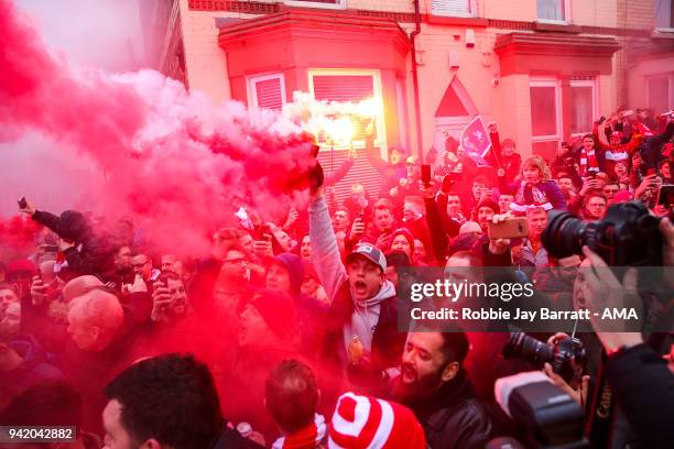 Fans of Liverpool let of flares prior to the UEFA Champions League Quarter Final first leg match between Liverpool and Manchester City at Anfield on...