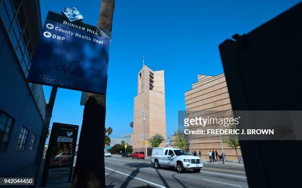 People gather outside the Cathedral of Our Lady of Angels in downtown Los Angeles, California for the tolling of 39 bells on April 4, 2018 in honour...