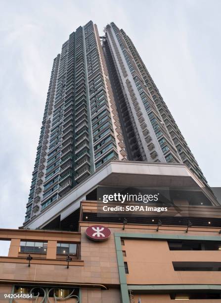 Hong Kong's MTR train company logo seen under a high rise residential building in Choi Hung area. Hong Kong is a city with 7.5 million population in...