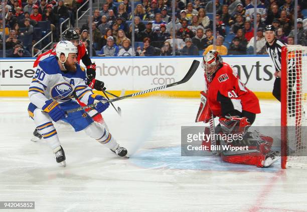 Ryan O'Reilly of the Buffalo Sabres scores an early first period goal against Craig Anderson of the Ottawa Senators during an NHL game on April 4,...