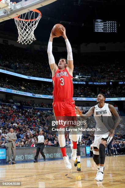 Omer Asik of the New Orleans Pelicans goes to the basket against the Memphis Grizzlies on April 4, 2018 at Smoothie King Center in New Orleans,...