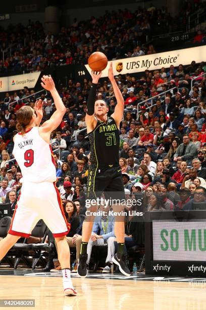 Mike Muscala of the Atlanta Hawks shoots the ball against the Miami Heat on April 4, 2018 at Philips Arena in Atlanta, Georgia. NOTE TO USER: User...