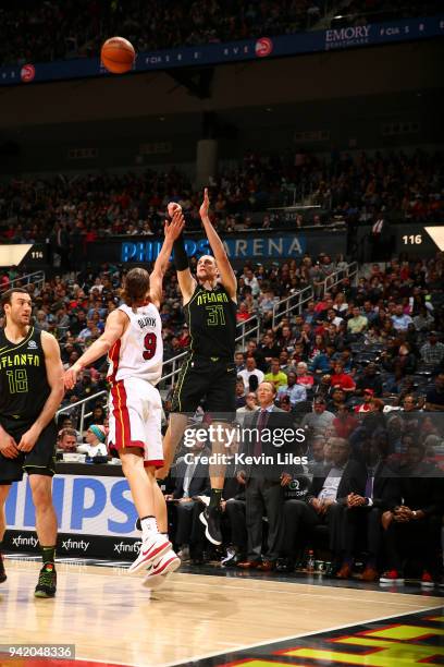 Mike Muscala of the Atlanta Hawks shoots the ball against the Miami Heat on April 4, 2018 at Philips Arena in Atlanta, Georgia. NOTE TO USER: User...