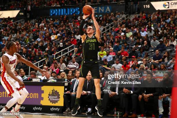 Mike Muscala of the Atlanta Hawks shoots the ball against the Miami Heat on April 4, 2018 at Philips Arena in Atlanta, Georgia. NOTE TO USER: User...