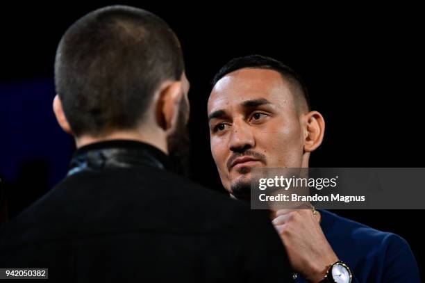 Max Holloway and Khabib Nurmagomedov of Russia face off during the UFC 223 Press Conference at the Music Hall of Williamsburg on April 4, 2018 in...