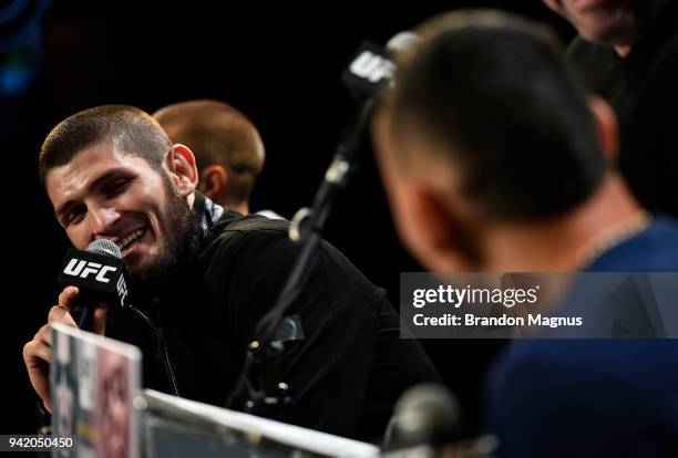 Khabib Nurmagomedov of Russia interacts with Max Holloway during the UFC 223 Press Conference at the Music Hall of Williamsburg on April 4, 2018 in...